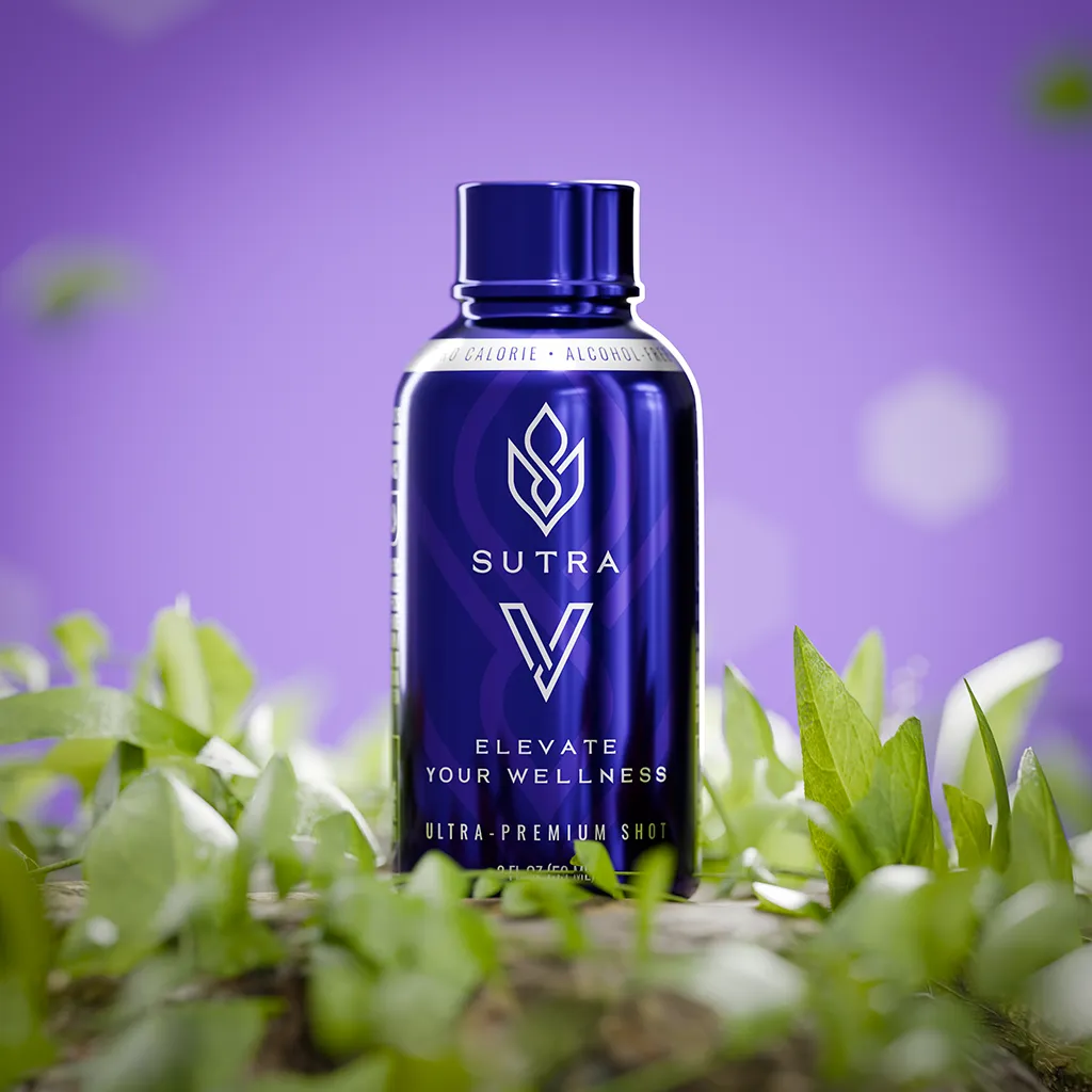 A purple bottle of Sutra V ultra-premium shot nestled in vibrant green leaves against a soft purple background.